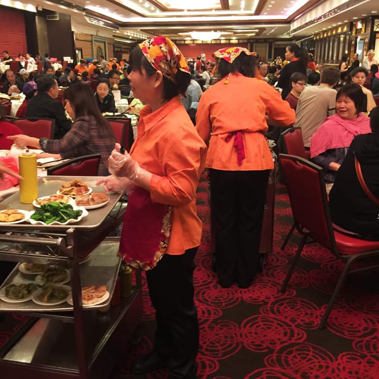 Waitresses at Jing Fong roll carts around with different foods