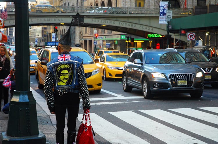 A local man hails a cab in NYC