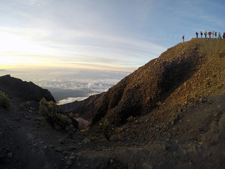 People line up to take photos at the Mt. Rinjani summit
