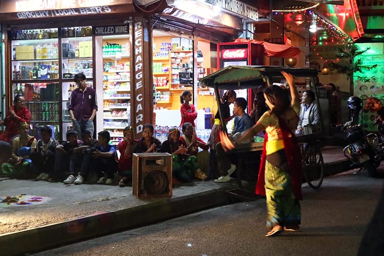 Children perform dances in the street for money during Tihar in Nepal