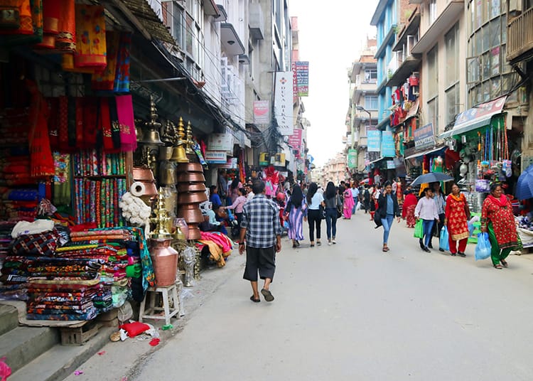 Local stores line the busy street of Mangal Bazar