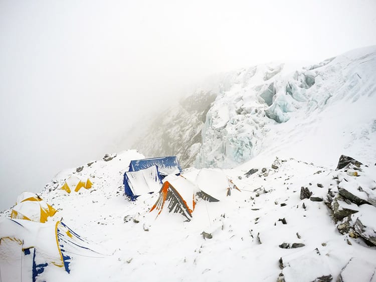Mera Peak High Camp where tents are covered in snow after a blizzard
