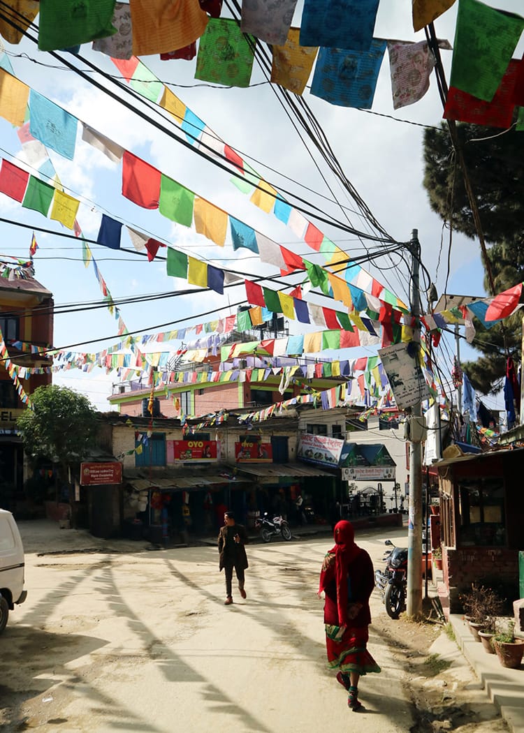 The main bazaar at Nagarkot in Nepal which has prayer flags flying overhead