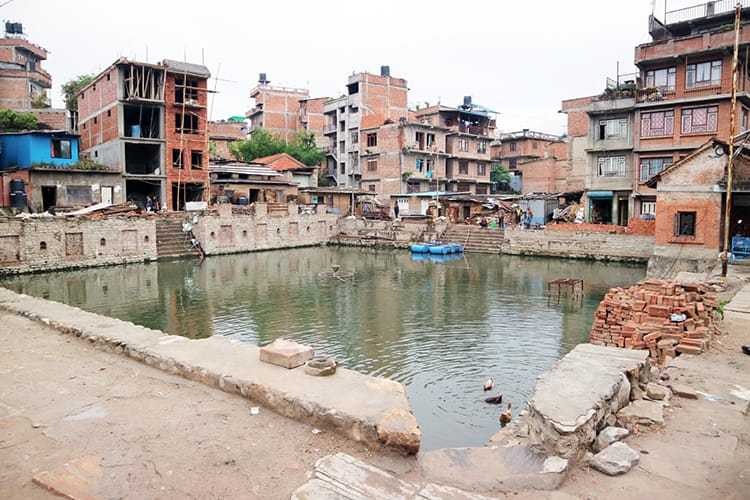 A manmade pond near a temple in Nepal