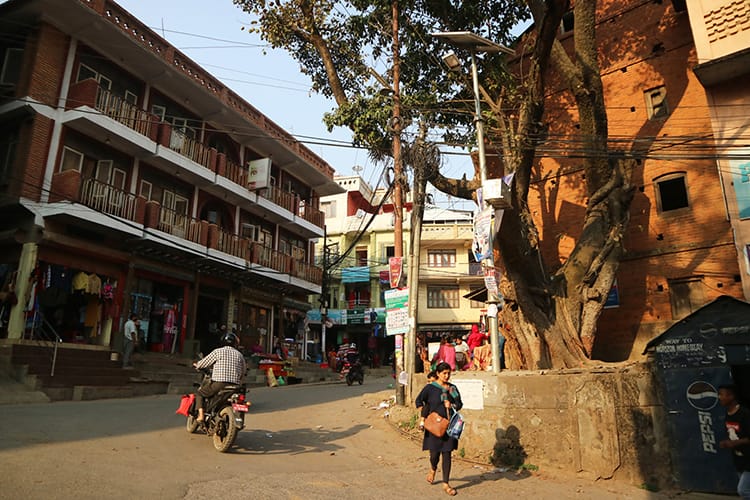 A chautari tree in the middle of a busy street in Tansen, Nepal