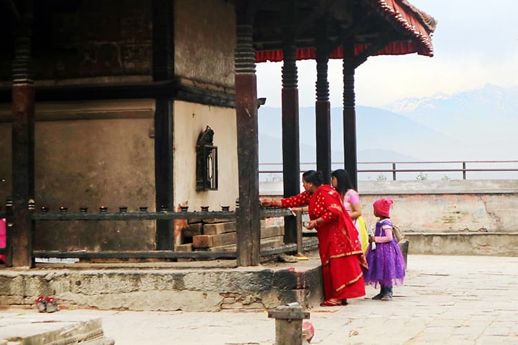 Women make offerings at the Baghbhairab Temple in Kirtipur