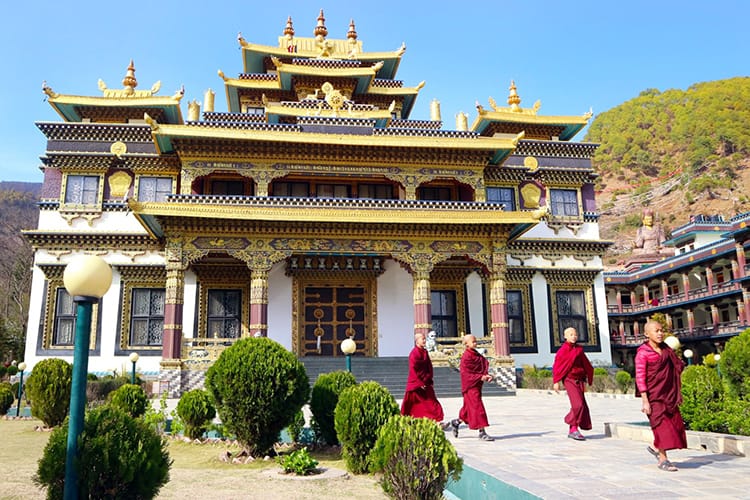 Four novice monks leave Azom Monastery to go to their dorms