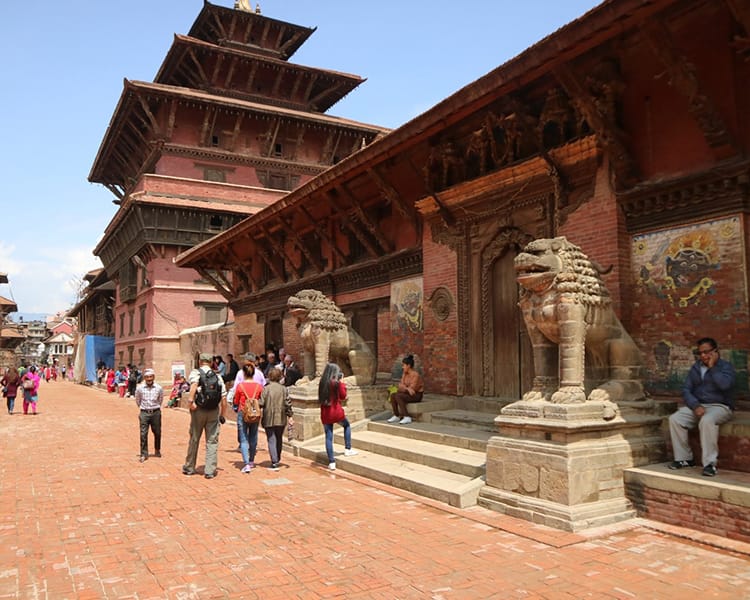 Tourists walk through Patan Durbar Square in Nepal