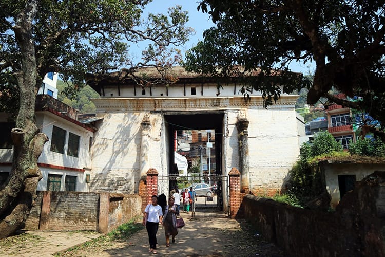 People walk through the Mul Dhoka Gate on the way to Tansen Durbar Square
