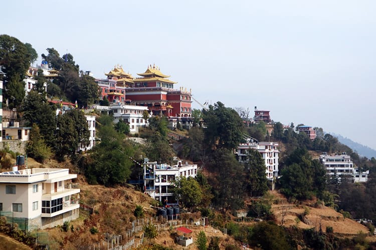 The many modern buildings that make up Namo Buddha Monastery which is set on a hill