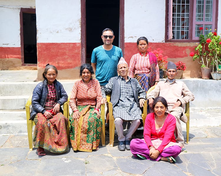 Suraj Pradhan's family members in Chilingkha take a family portrait in front of their farmhouse