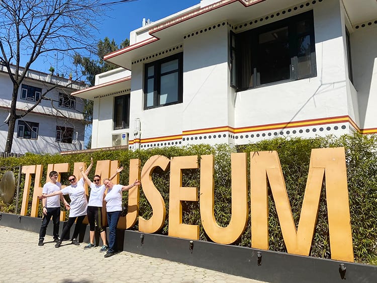 Michelle Della Giovanna from Full Time Explorer, Lisi, Pat and Carol stand in front of The Museum Hotel wearing all white before going out for Holi