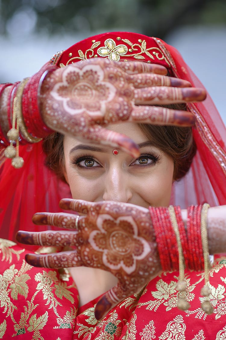 Michelle Della Giovanna from Full Time Explorer shows off her mehendi on her hands before the ceremony