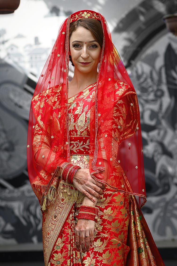 Michelle Della Giovanna from Full Time Explorer wearing a traditional Newari wedding saree