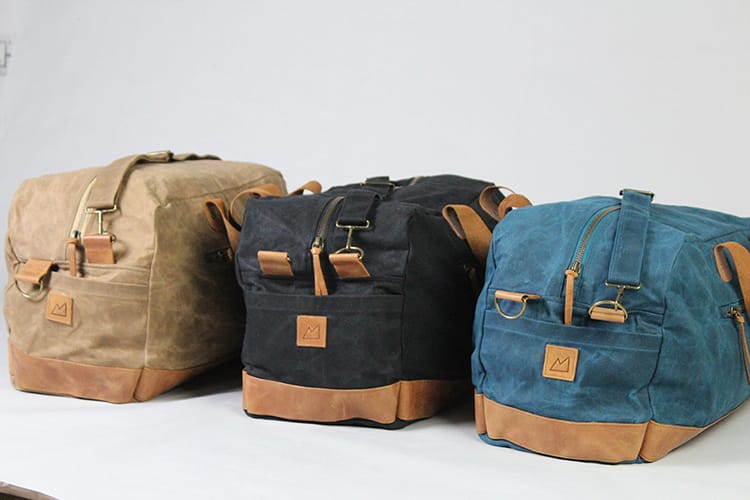 Three duffel bags made by Purnaa a sustainable brand in Nepal