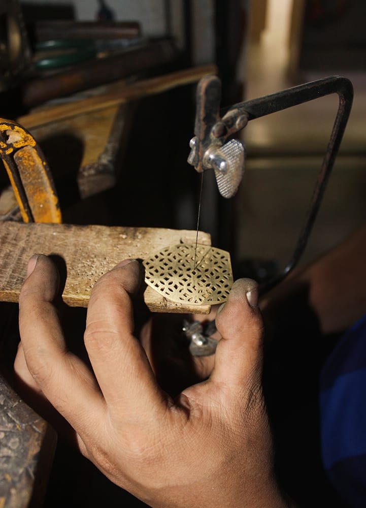 A local artisan makes an earring by hand for Aksa Nepal