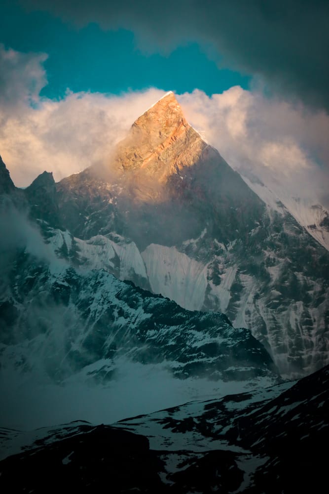 Machhapuchhre Fish Tail Mountain at sunset as the light hits the stone peak