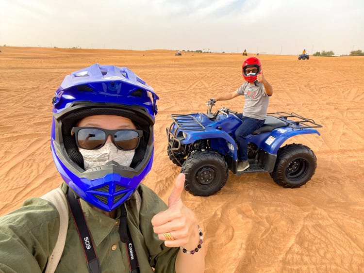 Michelle and Suraj ATVing during the overnight desert safari in Dubai