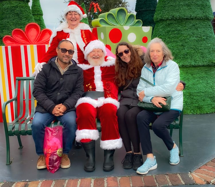 Michelle, Suraj, and Mom with Santa and Mrs Claus in Myrtle Beach