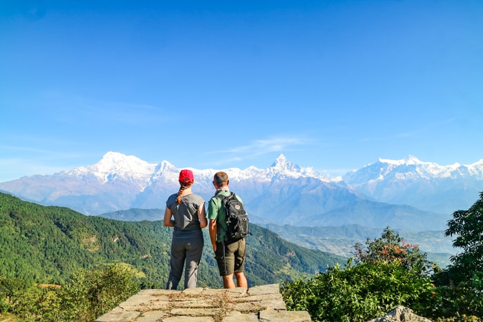 Two trekkers admiring the mountain view