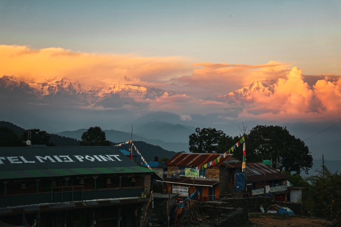 The sunset over the town of Panchase Bhyanjang with the Himalaya Mountains in the background
