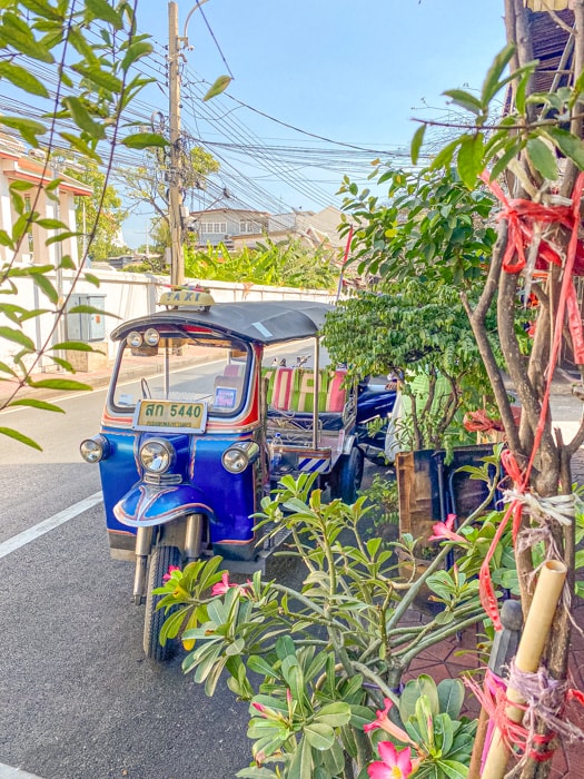 A tuk tuk on the side of the street in bangkok - Best Things to do in Bangkok