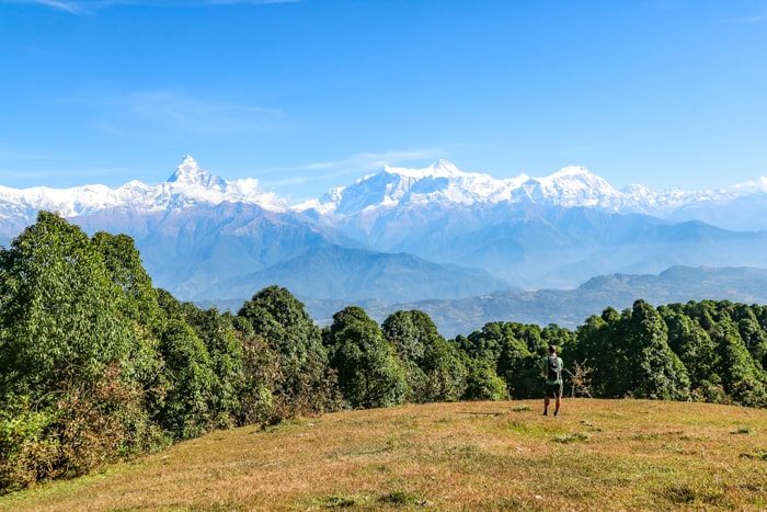 A field along the Panchase Trek Route with the Himalaya Mountains in the distance