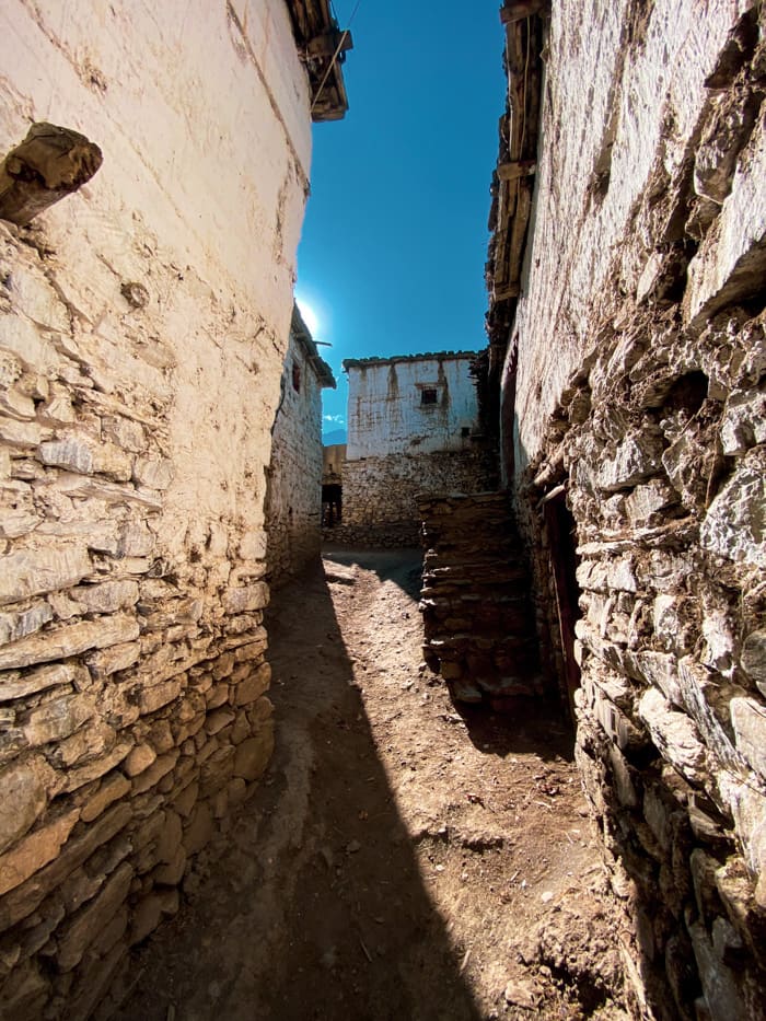 A small alleyway between stone buildings
