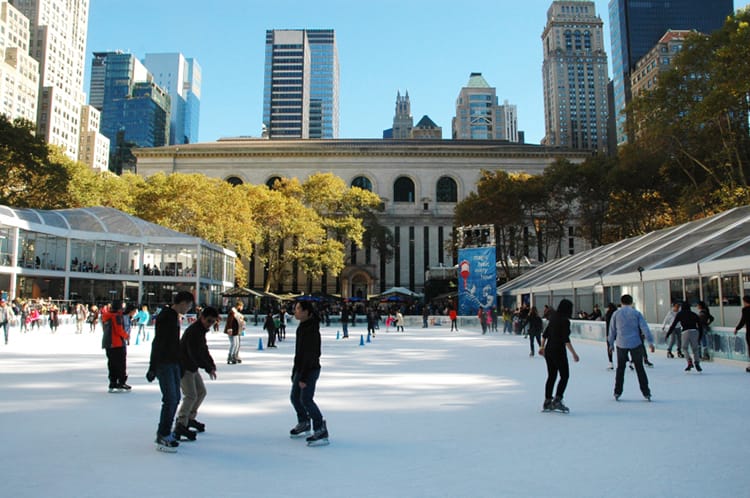 People skate at the ice skating rink in Bryant Park