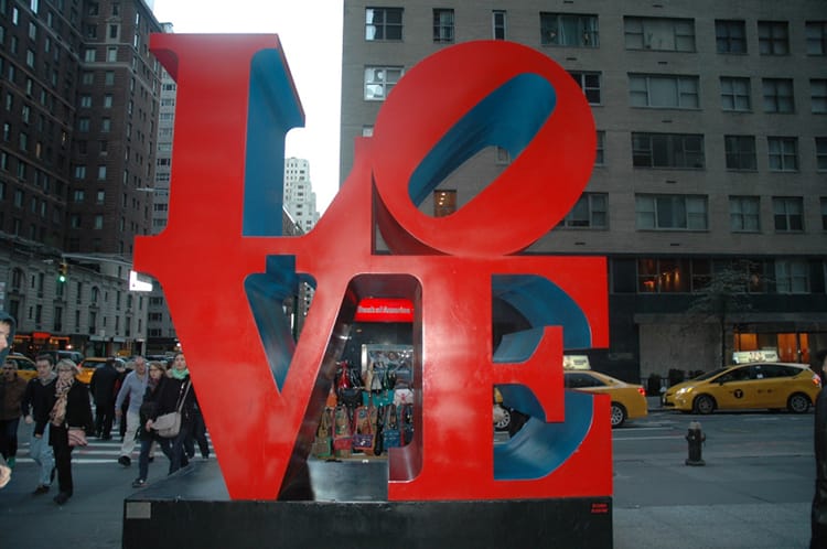A giant sign that says love on 55th street in New York city