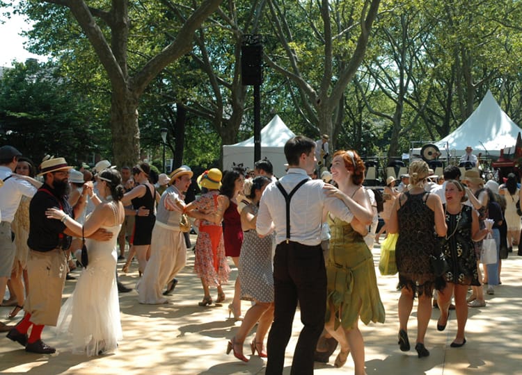 A couple dances on the dance floor of the Jazz Age Lawn Party on Governors Island