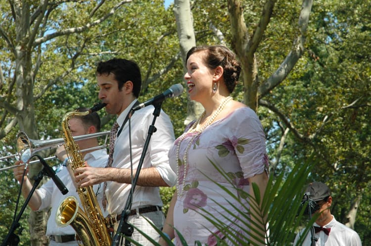 A woman sings with a jazz band at the Jazz Age Lawn Party on Governors Island