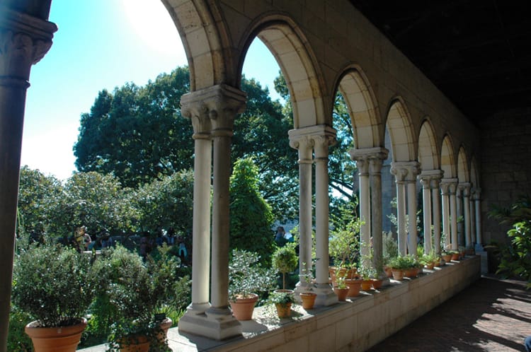 Beautiful archways lead to a garden in The Cloisters