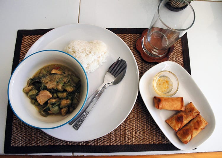 Thai green curry with chicken and spring rolls made in a Thai cooking class in Chiang Mai
