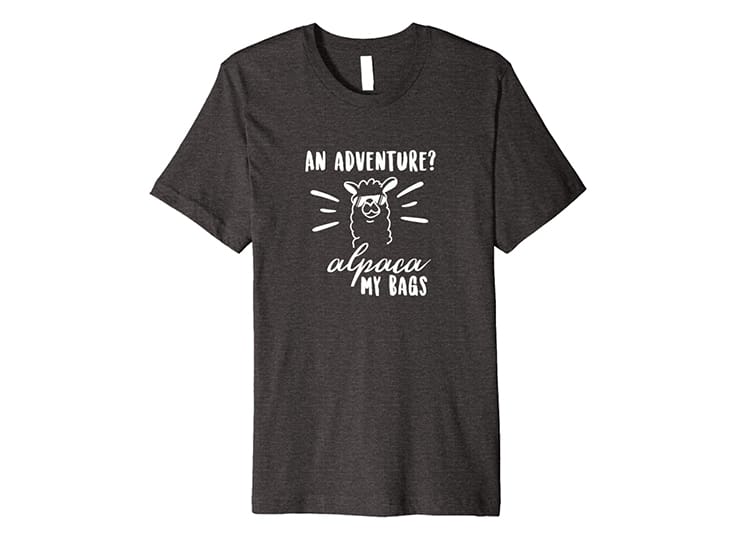 T-shirt that says "An Adventure? Alpaca my bags" with an alpaca picture