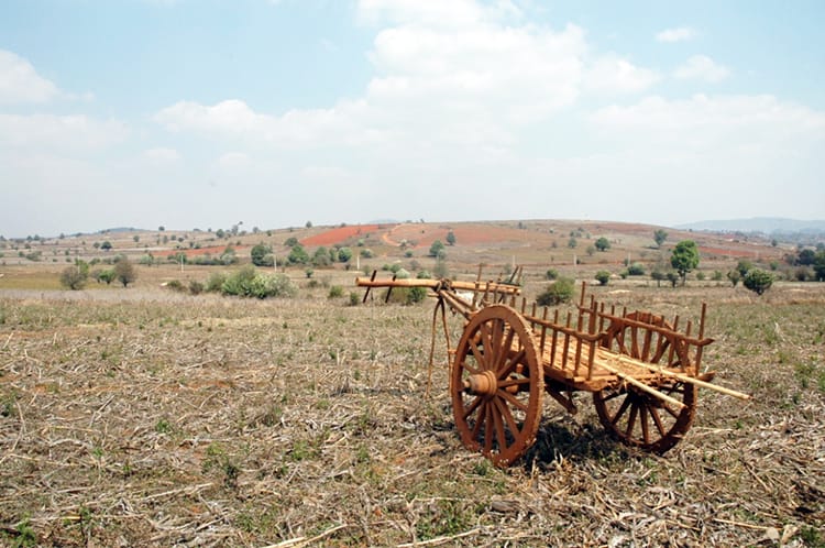 A wooden plow sits in a field in Myanmar