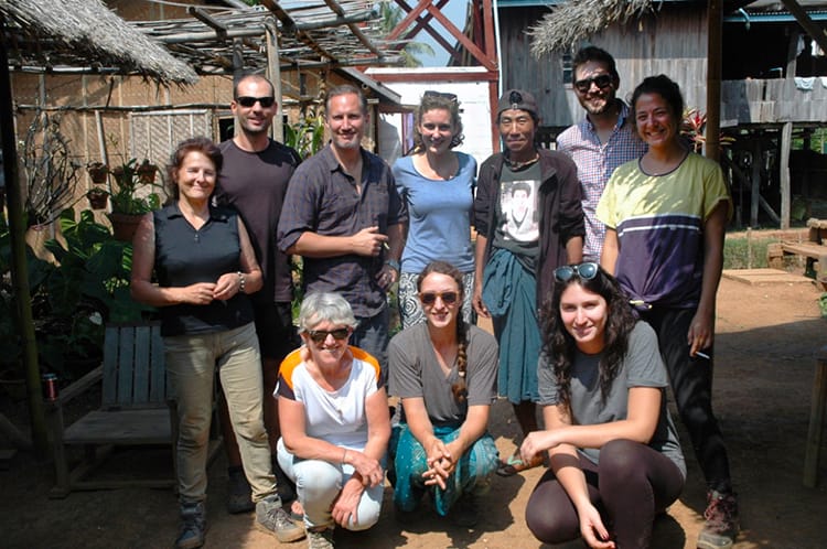 Michelle Della Giovanna from Full Time Explorer and her tour group pose for a photo near Inle Lake after completing the Kalaw Trek in Myanmar