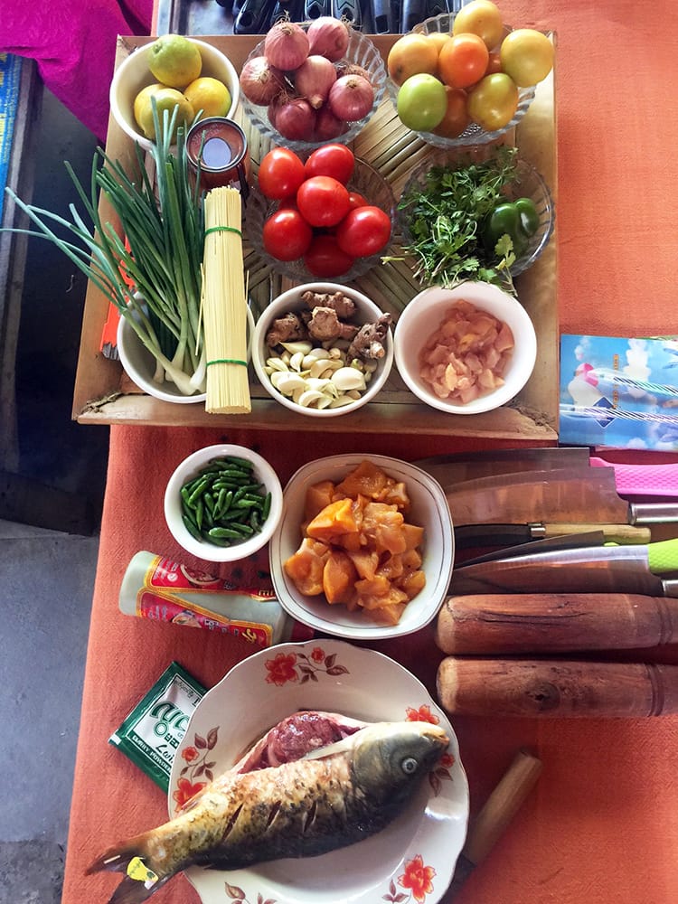 All of the ingredients needed for our Burmese cooking class laid out on a table and prepped