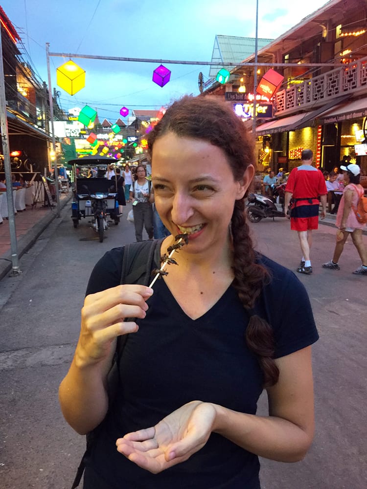 Michelle Della Giovanna from Full Time Explorer eats crickets in Cambodia