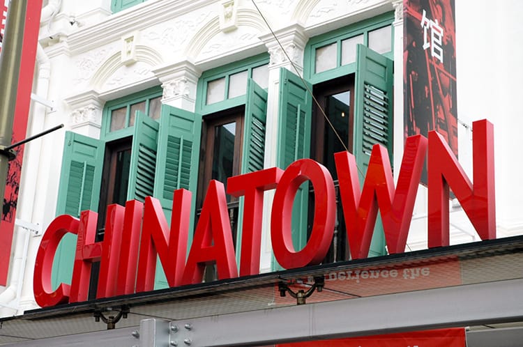 A bright red sign that says "Chinatown" in Singapore