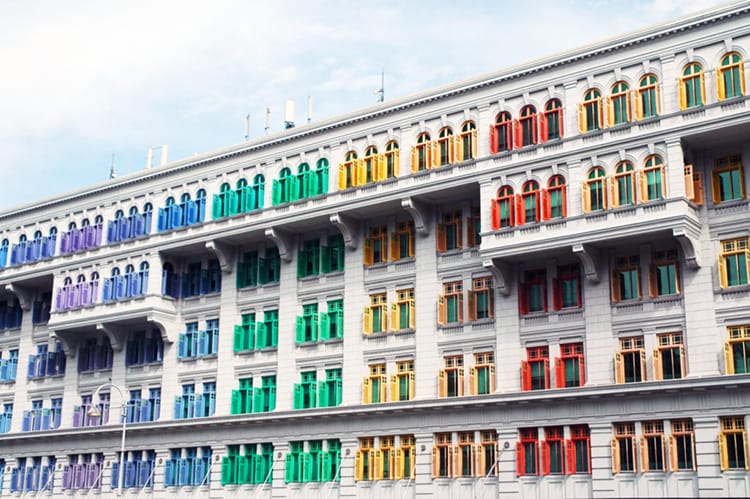 Rainbow colored window shutters line the police station in Singapore