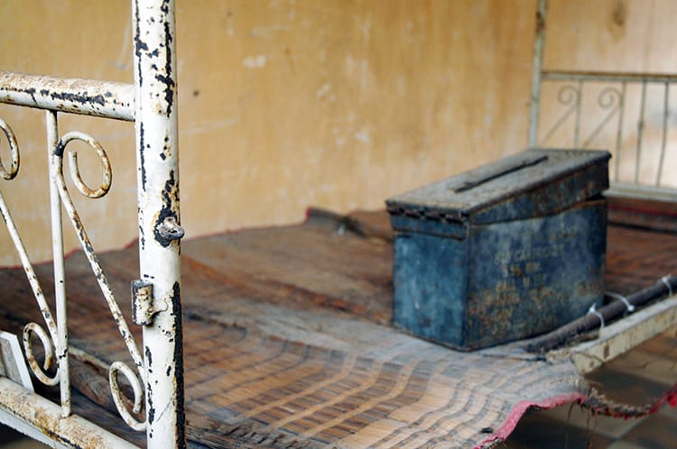 The bed of a prisoner is rusted in S21 Prison in Phnom Penh, Cambodia