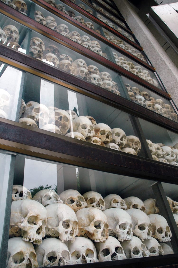Thousands of sculls stacked meticulously on top of each other in a glass building at the Killing Fields in Phnom Penh, Cambodia