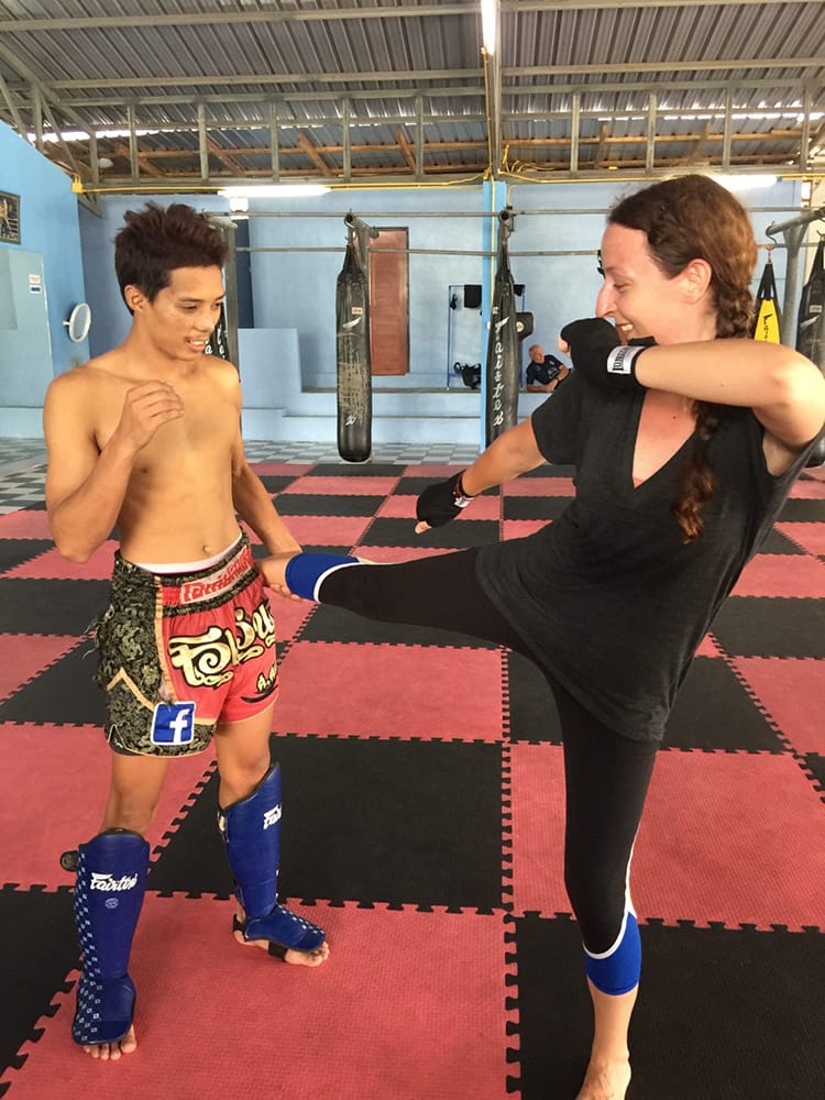 Michelle Della Giovanna from Full Time Explorer does drills with her coach during Muay Thai Classes in Thailand