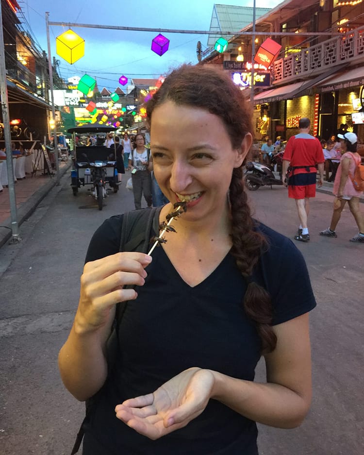 Michelle Della Giovanna from Full Time Explorer eats crickets in Siem Reap