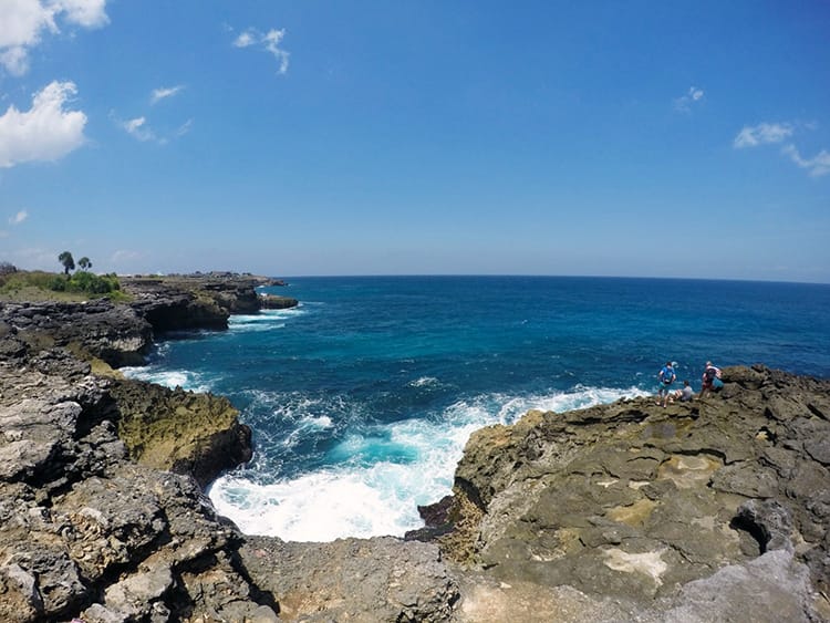 Water breaking on the cliffs of Sunset Point in Nusa Lembongan