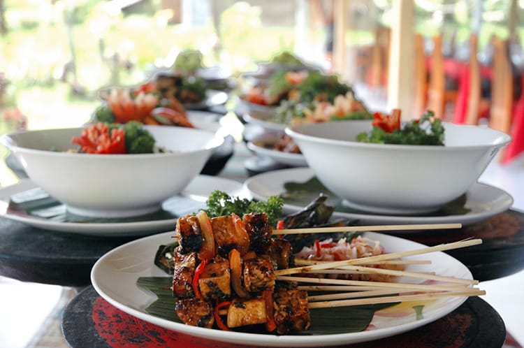 Several types of Balinese food are arranged on a table ready to eat after class