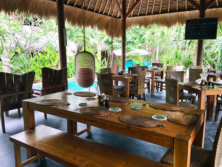 The indoor outdoor seating area by the pool at Tigerlilly Restaurant in Nusa Lembongan Bali