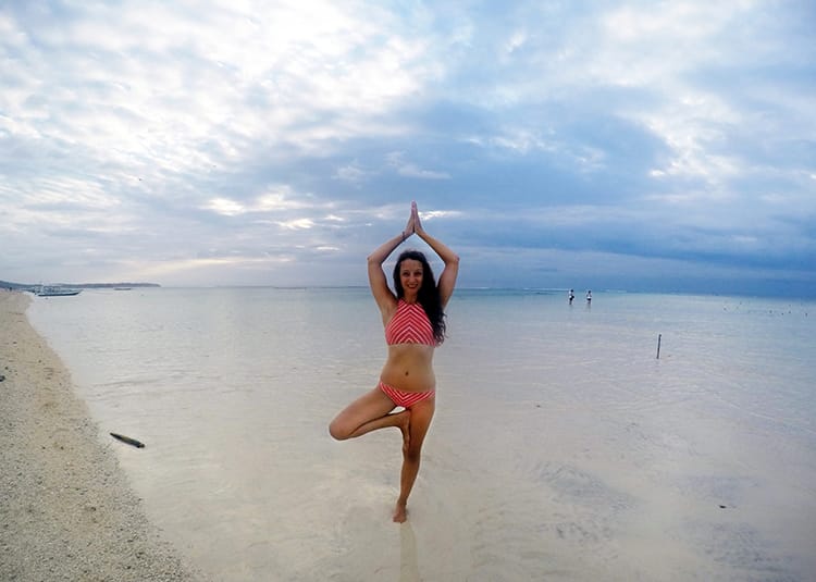 Michelle Della Giovanna from Full Time Explorer does Yoga on the beach of Nusa Lembongan
