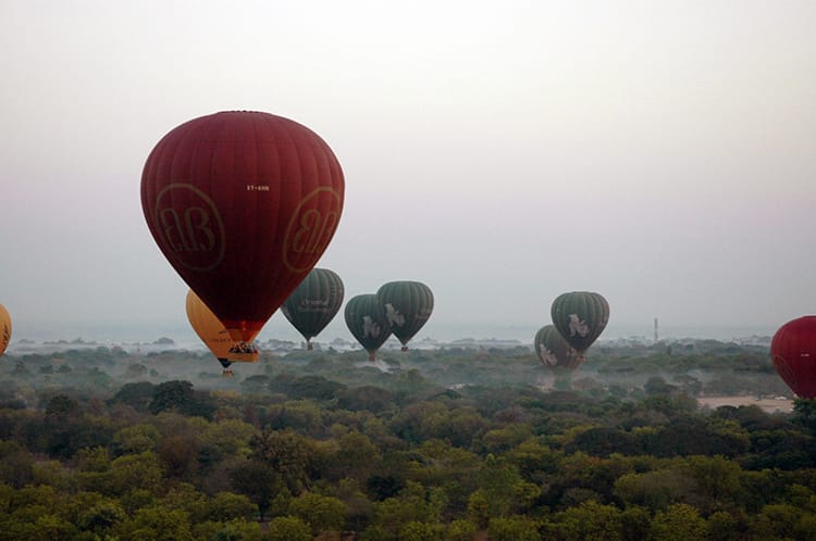 Hot air balloons fly over Bagan before sunrise